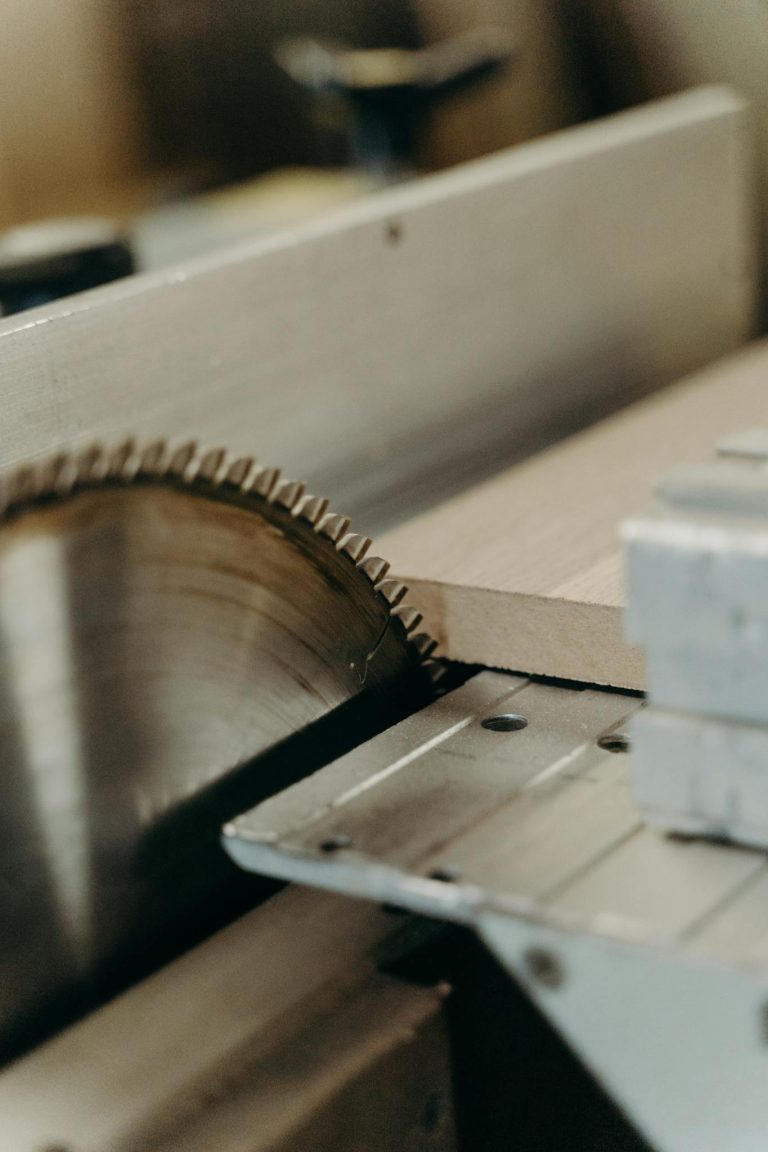 A detailed view of a circular saw blade, highlighting cutting precision in woodworking.